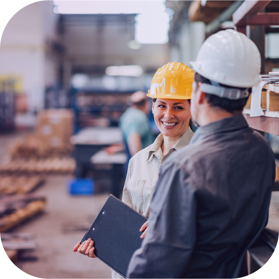 man and woman with hardhats