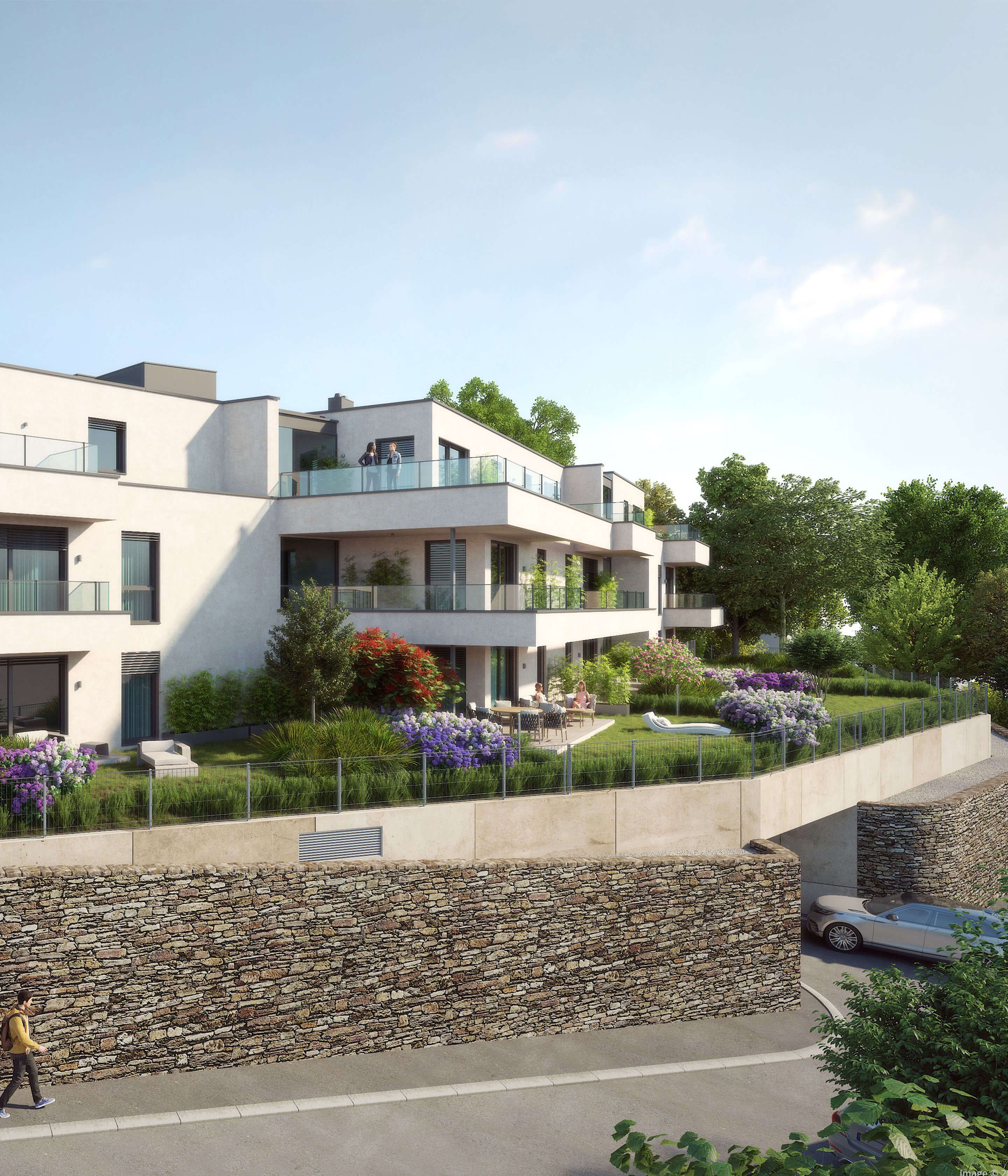 Image: Three-storey residential building with children's playground and greenery