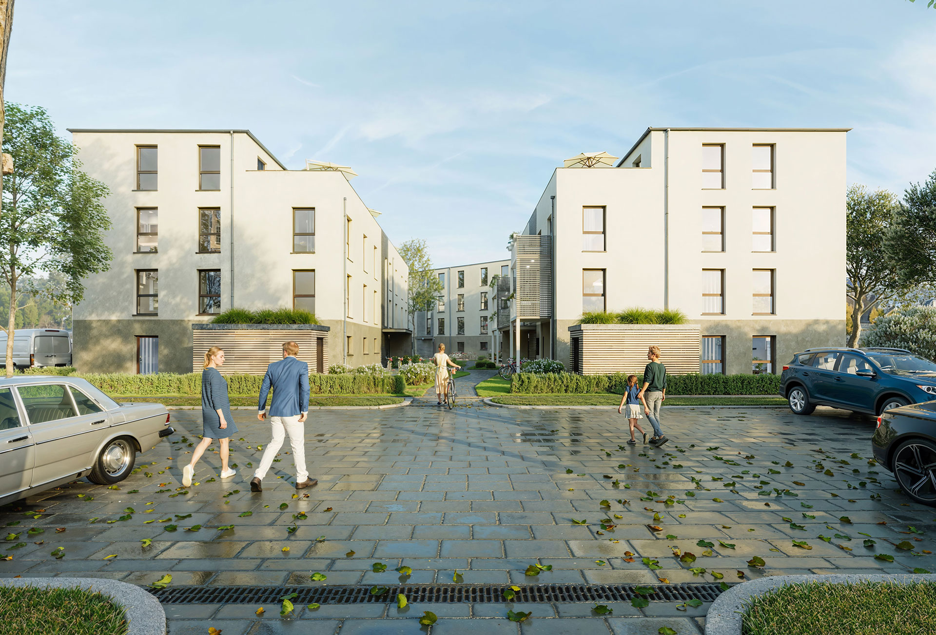 Pflasterstein-Parkplatz im Vordergrund - im Hintergrund modernes MOLENO-Wohnquartier