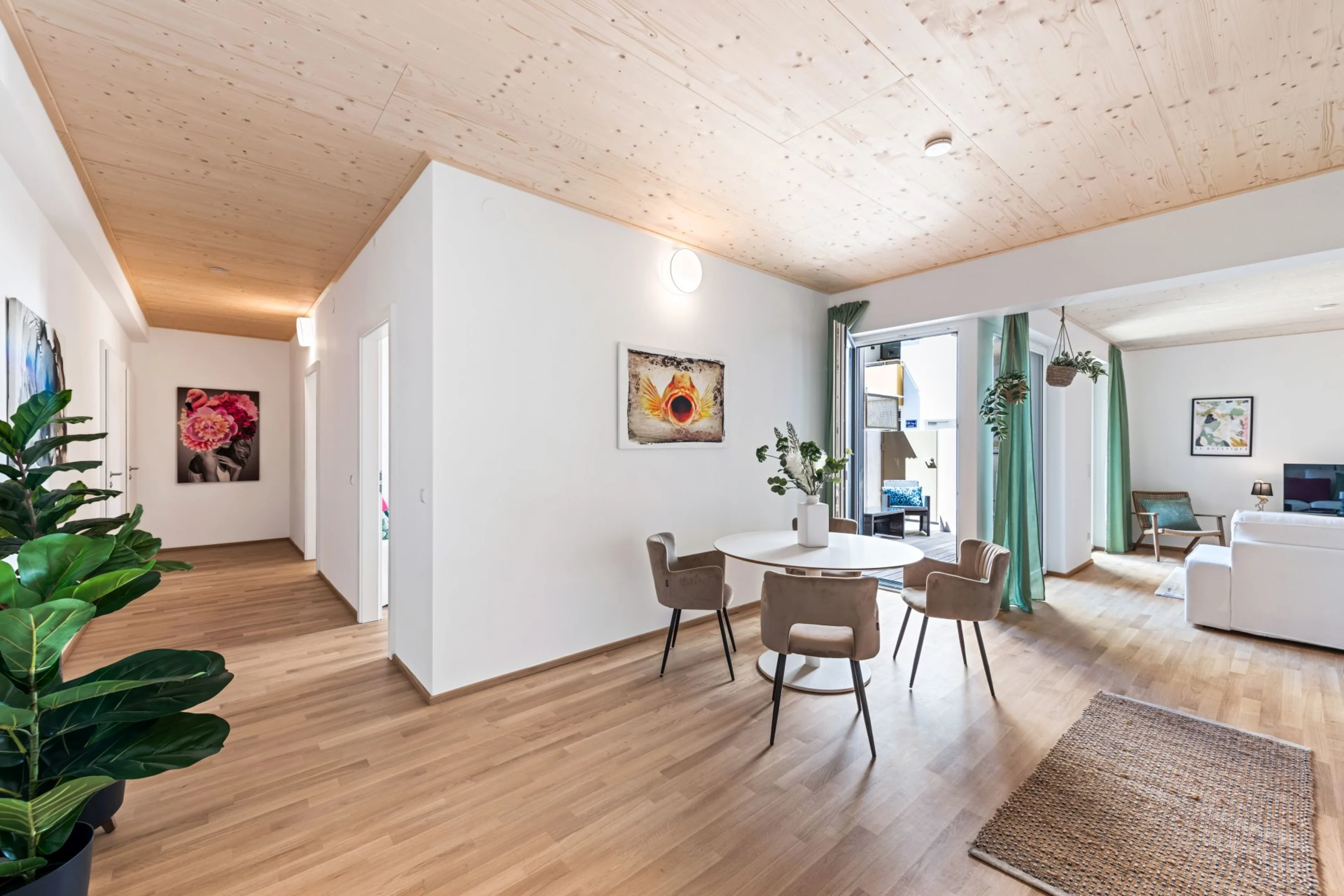 Image: Modern living room with wooden ceiling and parquet floor.