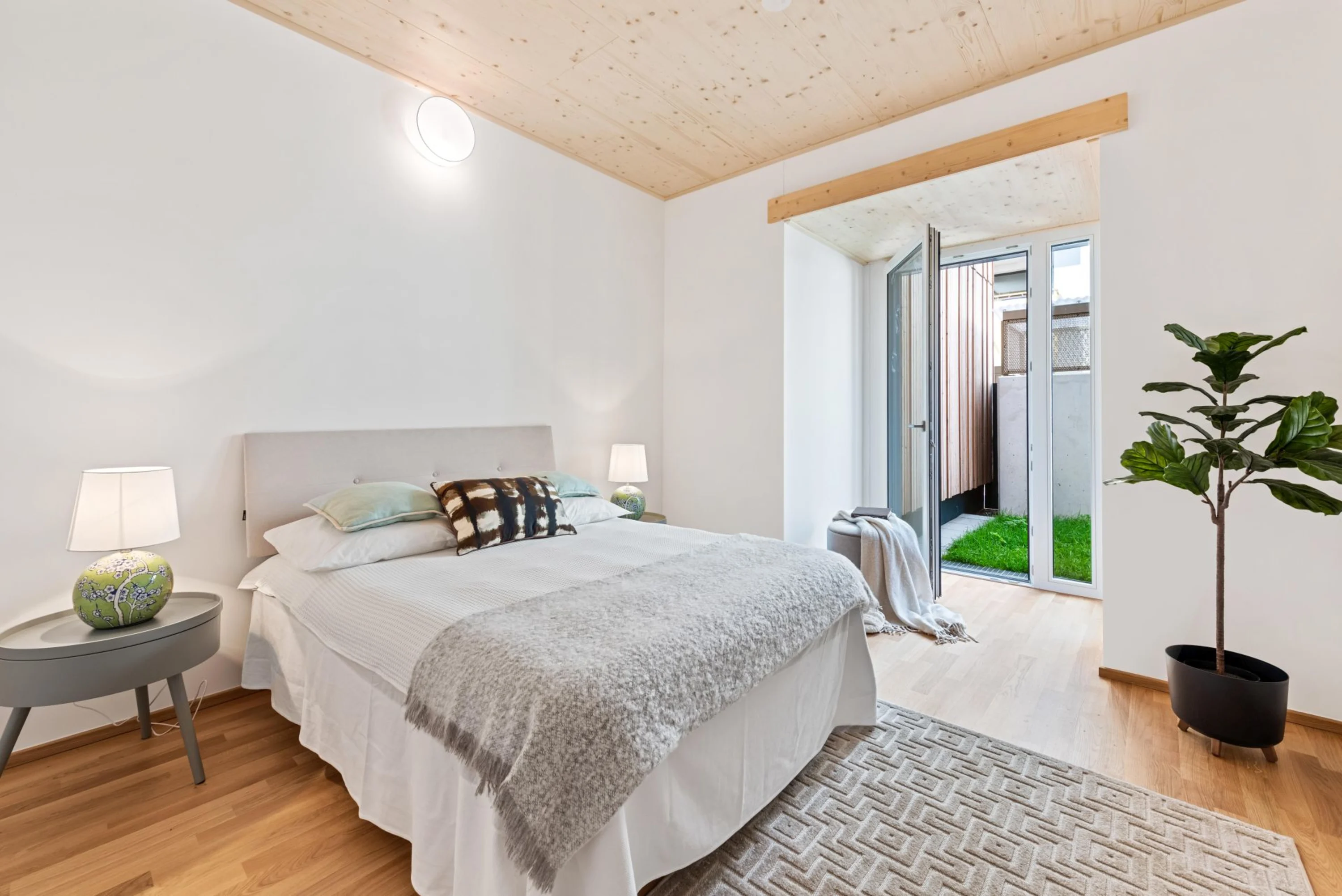 Photo: Bright bedroom with direct access to the garden.
