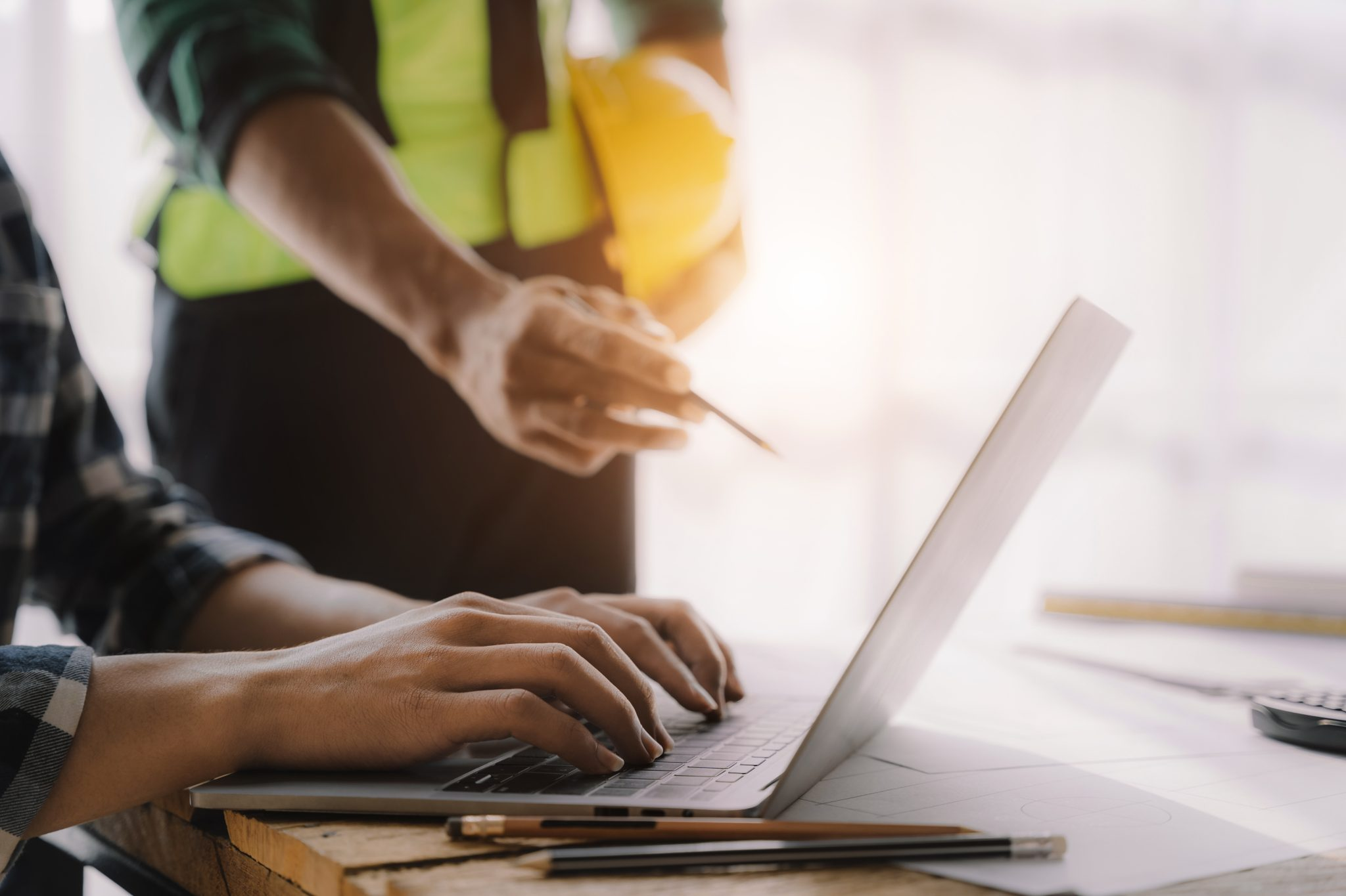 Construction workers on laptop