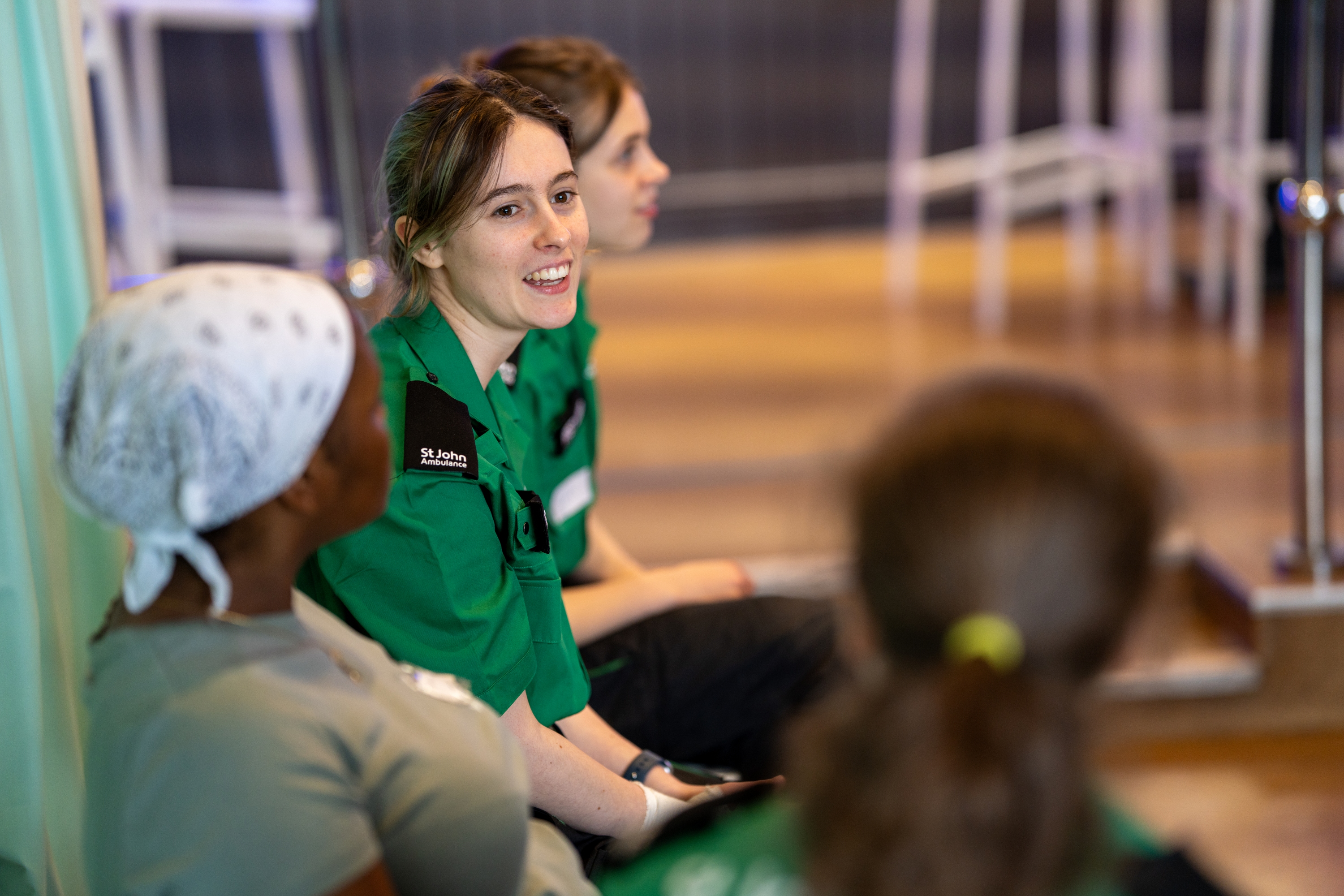 A St John Ambulance volunteer talking to trainees.