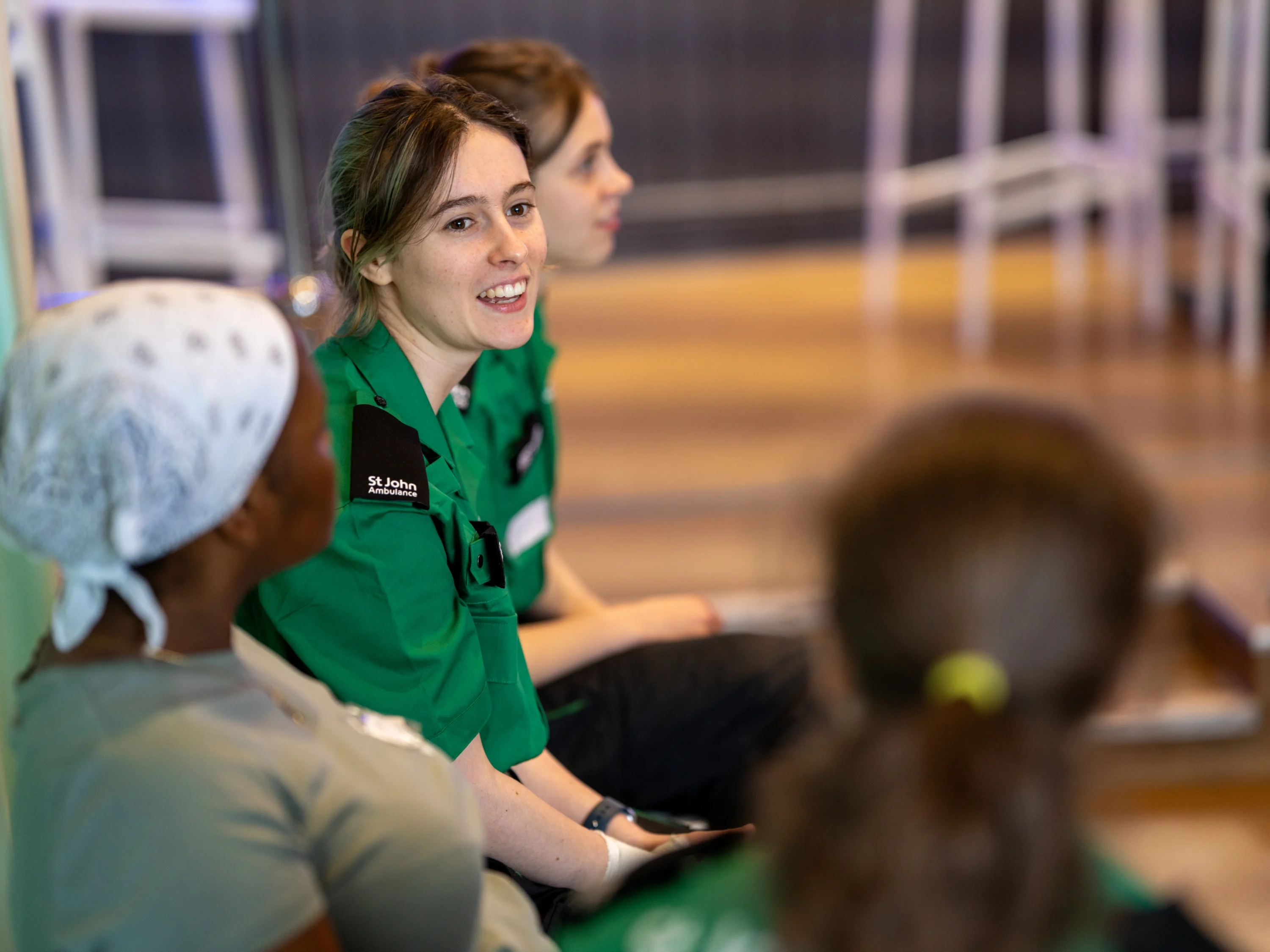 A St John Ambulance volunteer talking to trainees.