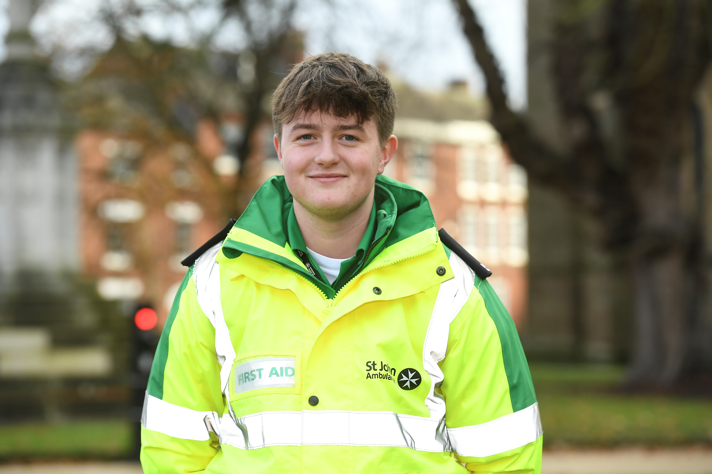 A male Event Healthcare first aider posing in a hi-vis jacket.