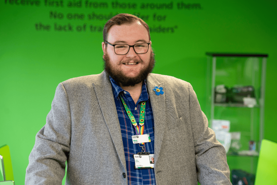 A photograph of Ross Comer smiling to camera.