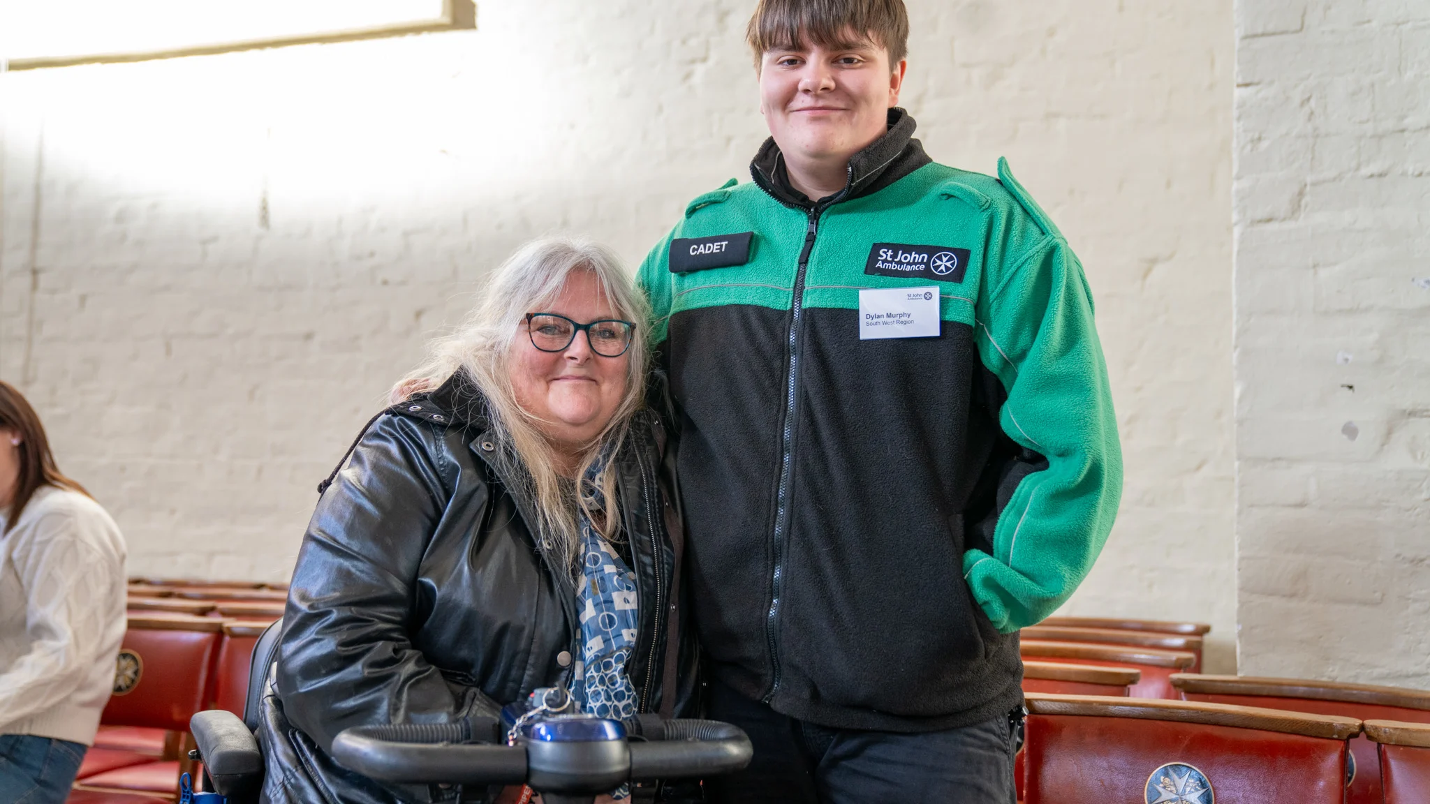 A photograph of Dylan and his mum. Dylan's wearing his St John uniform.