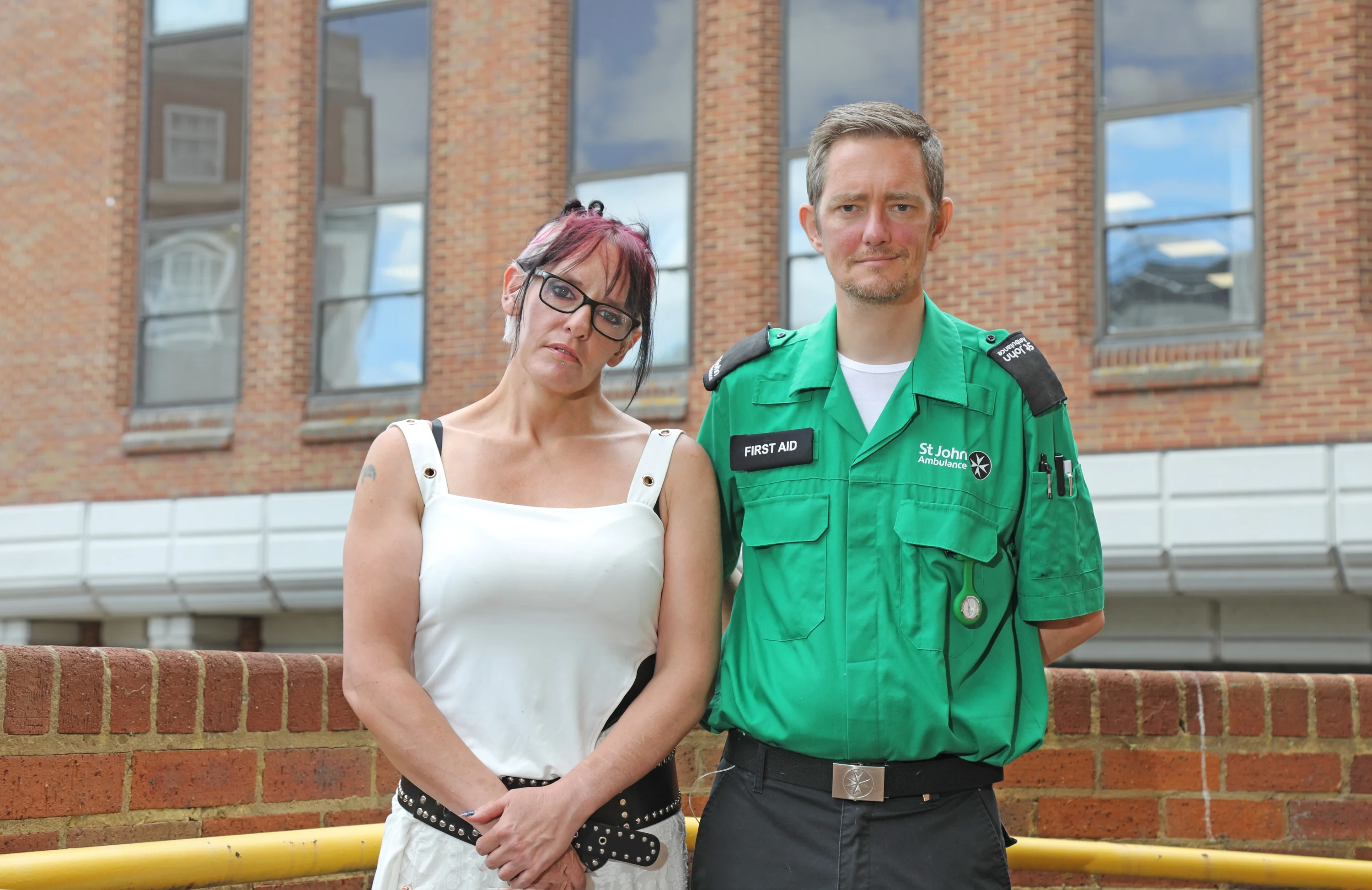Peter, wearing their St John Ambulance volunteer uniform, stood next to Jo. 