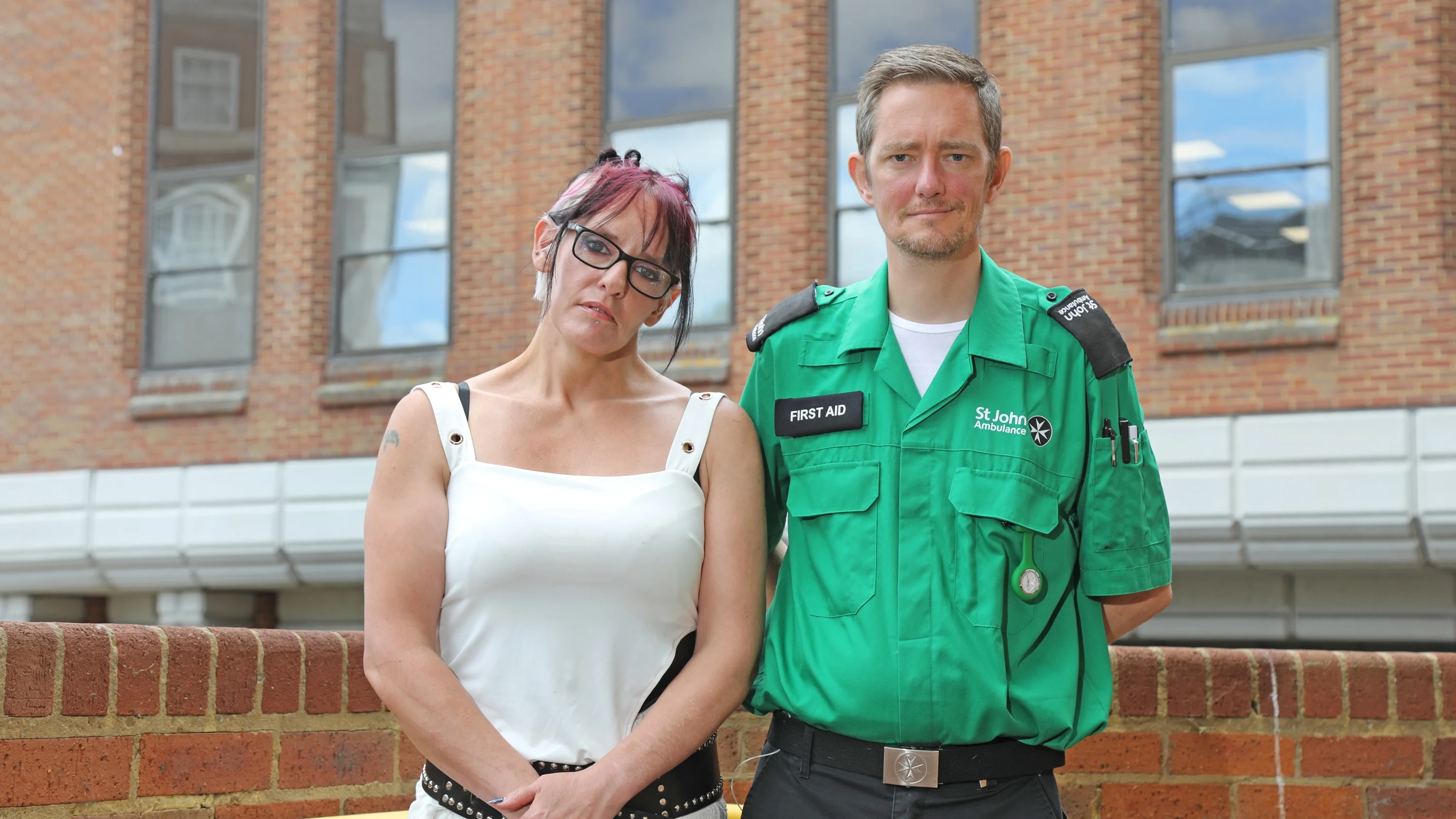 Peter, wearing their St John Ambulance volunteer uniform, stood next to Jo.