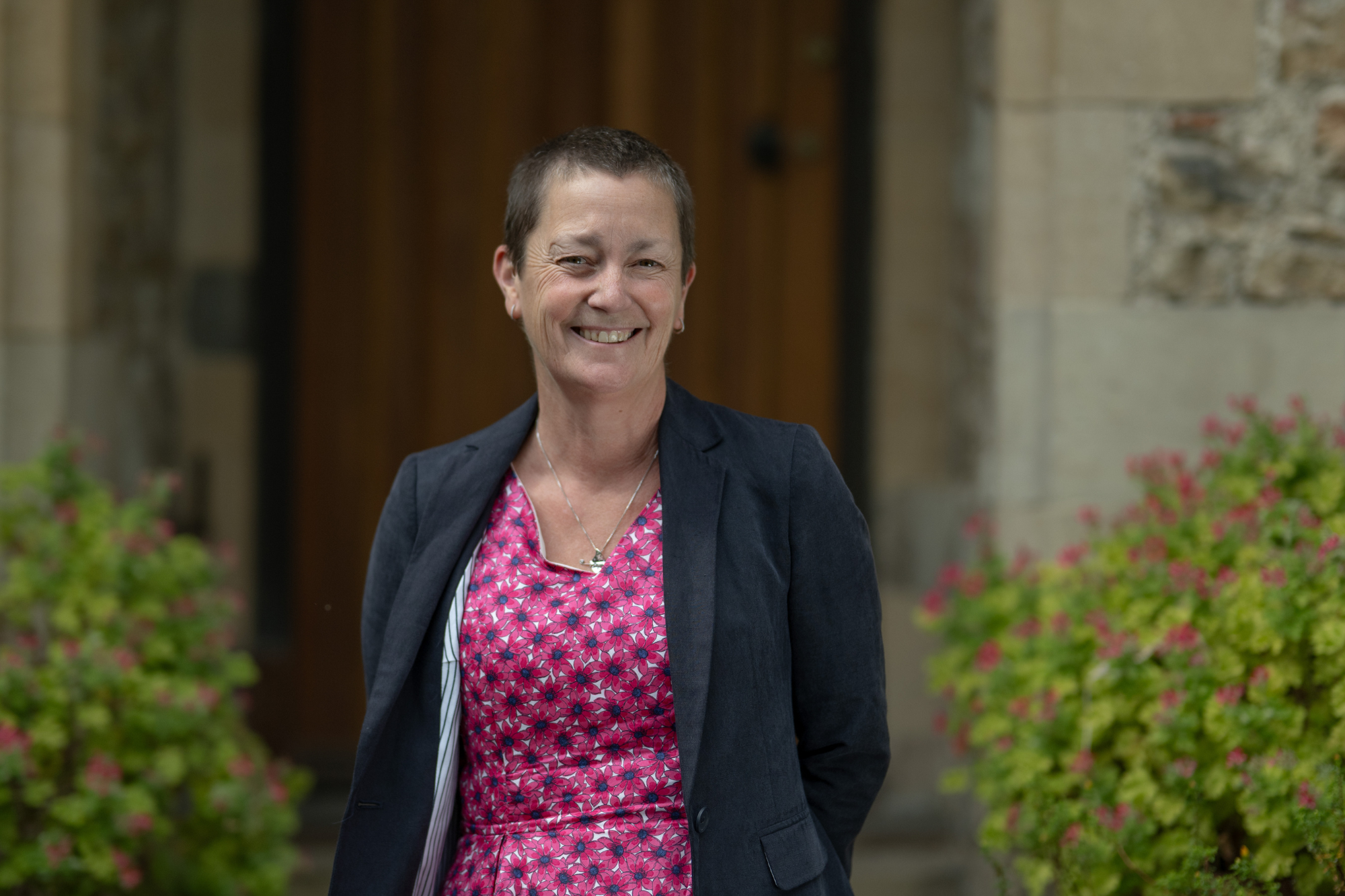 A photograph of Lynn Thomas smiling.