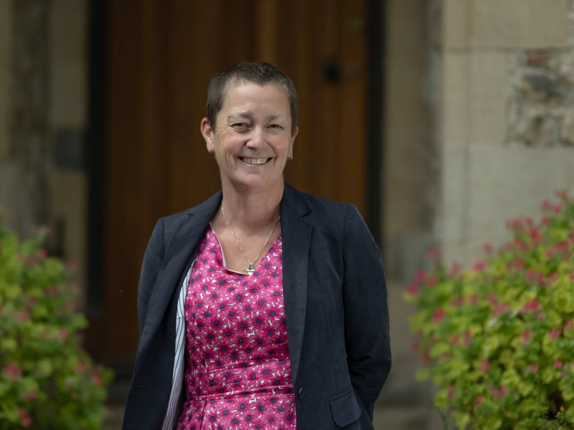 A photograph of Lynn Thomas smiling.