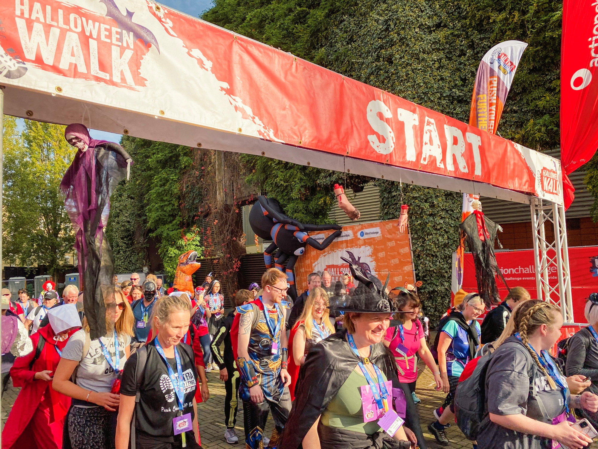 A group of people in fancy dress and with spooky props as they start on the London Halloween Walk Ultra Challenge.
