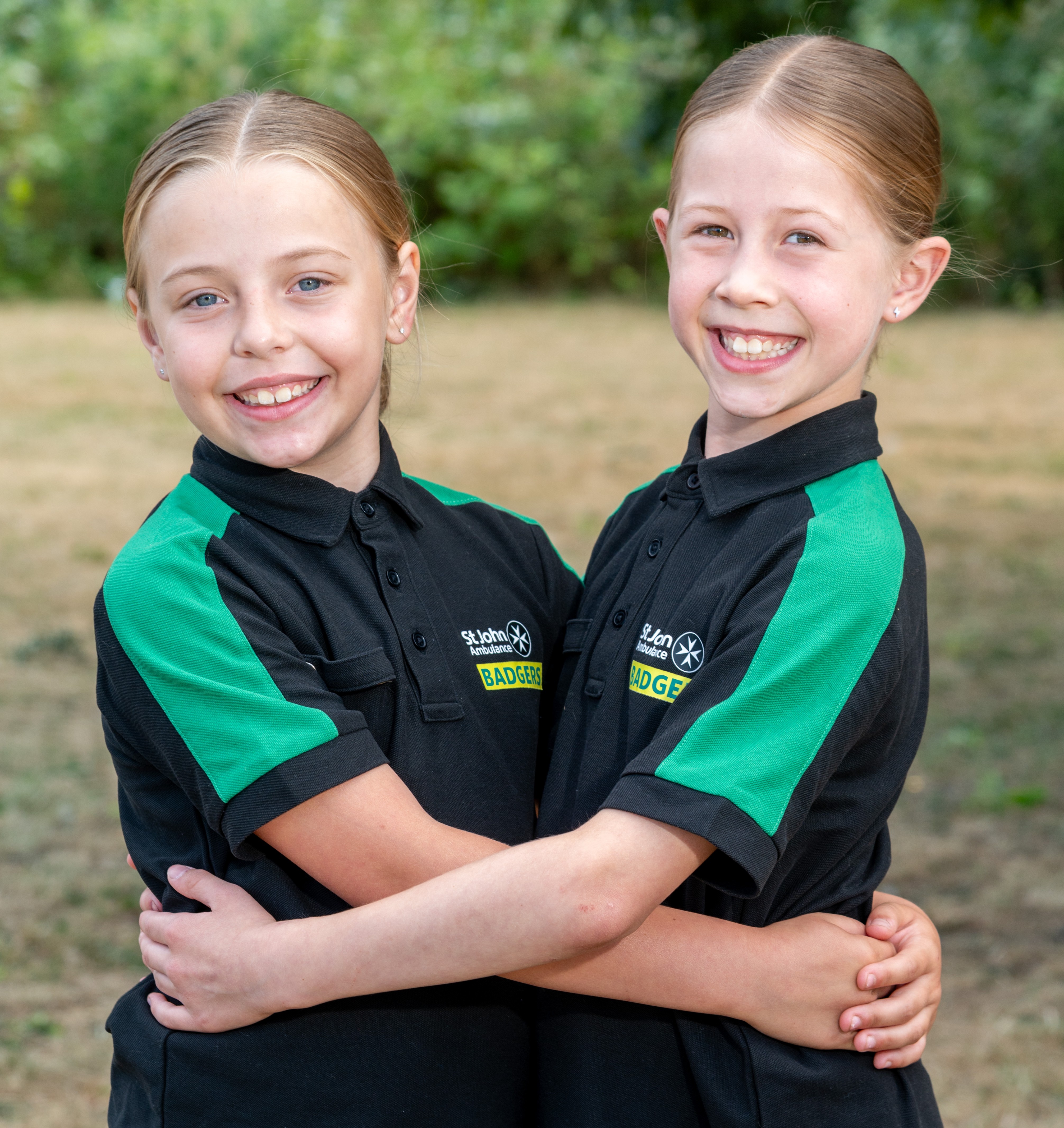 Effie and Poppy wearing their Badgers uniform.
