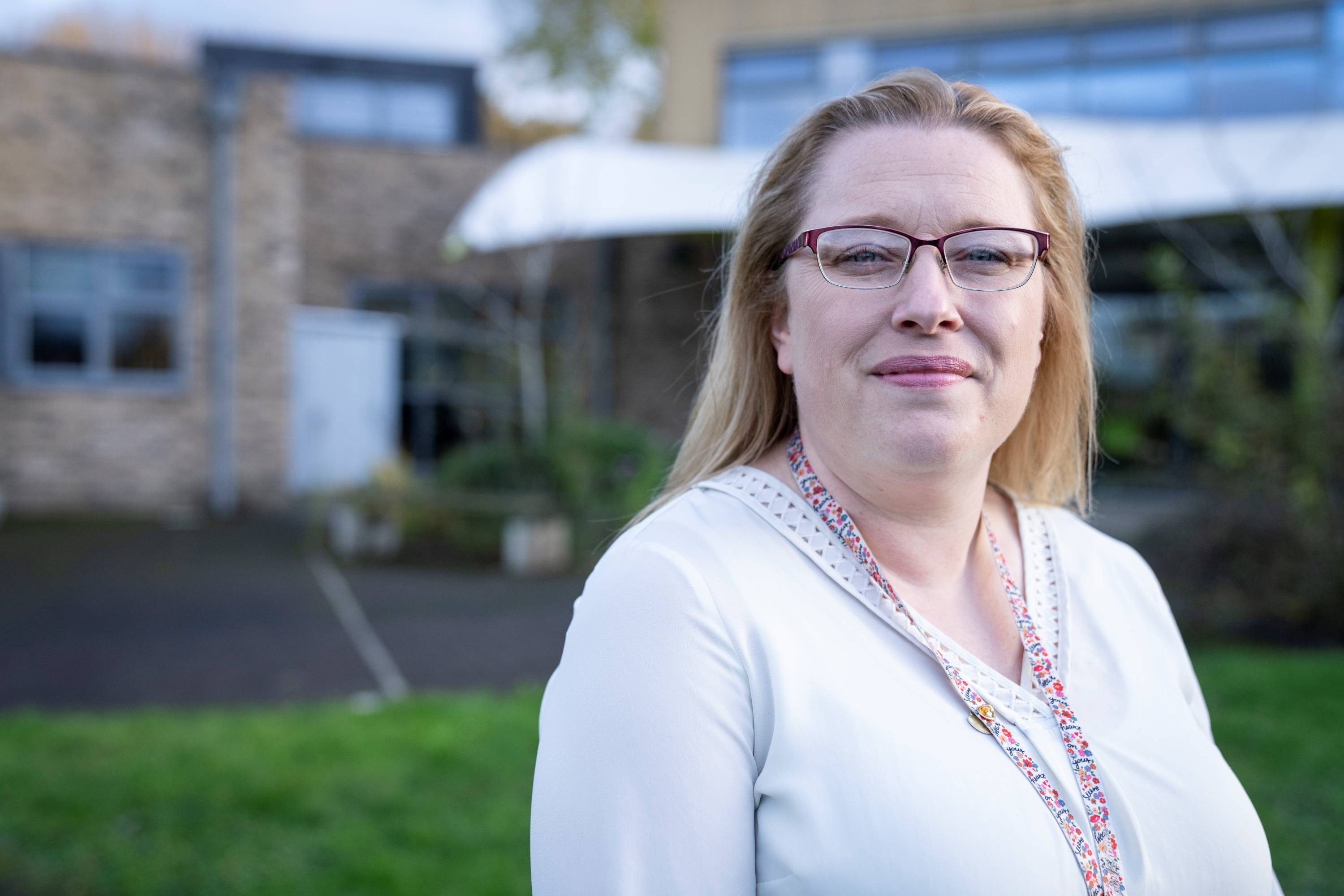 A photograph of Judith looking confidently into the camera.