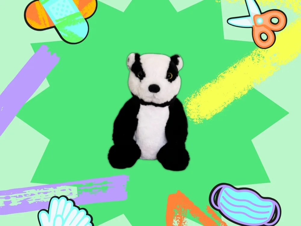 A cuddly toy badger with illustrations of plasters, a pair of scissors, latex gloves, and a mask around it.
