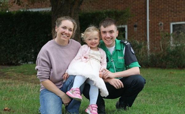 A photograph of Jack with his wife and baby girl, whose life he saved.