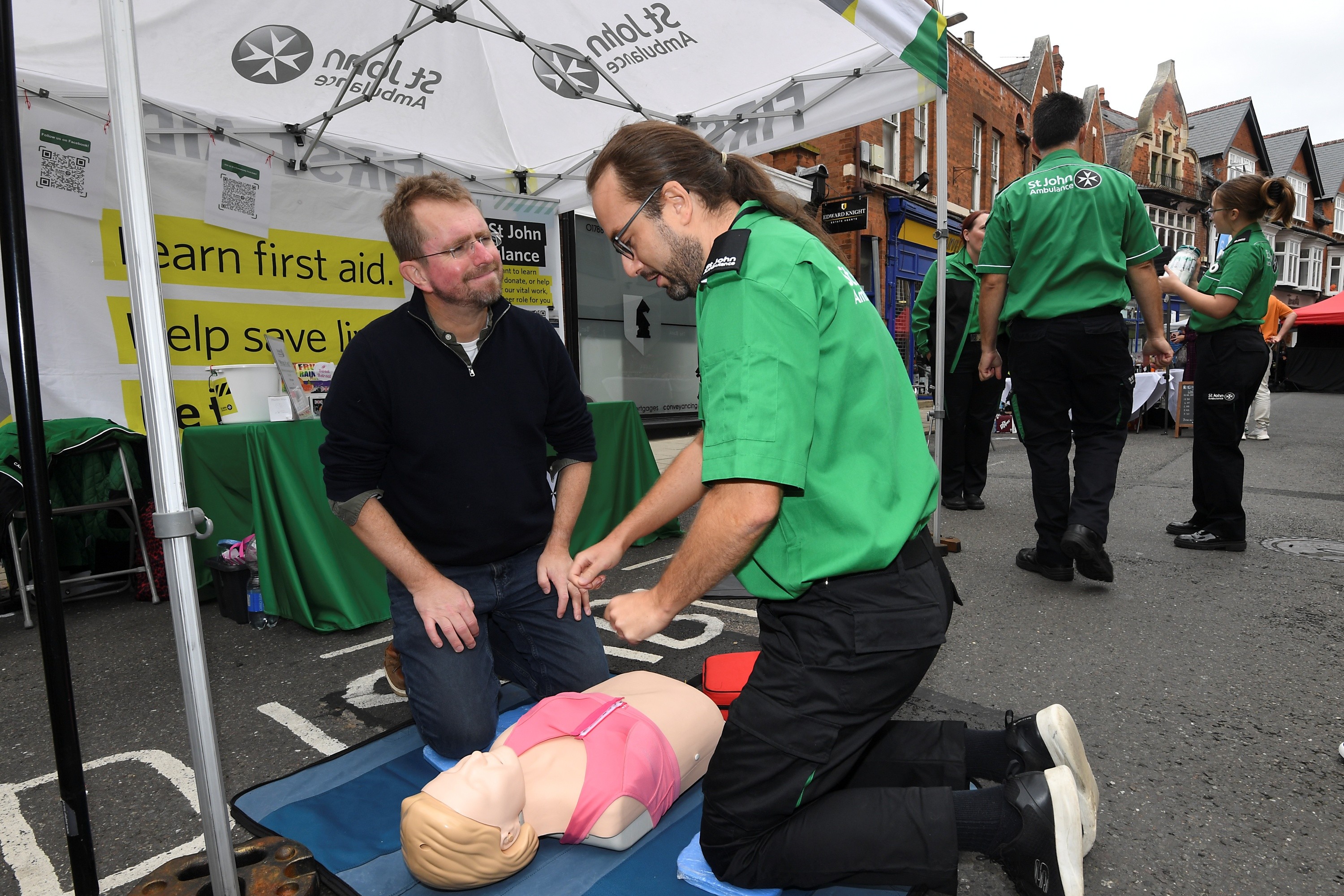 A St John Ambulance trainer giving a demonstration.