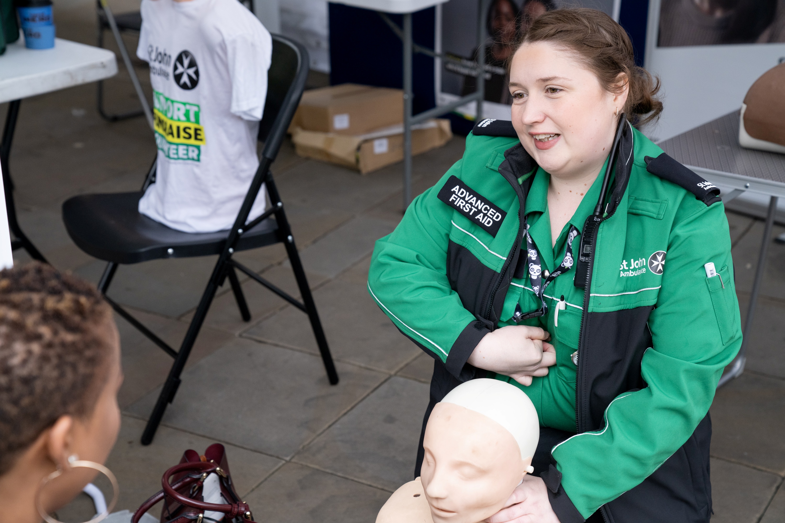 A St John Ambulance trainer giving a demonstration.