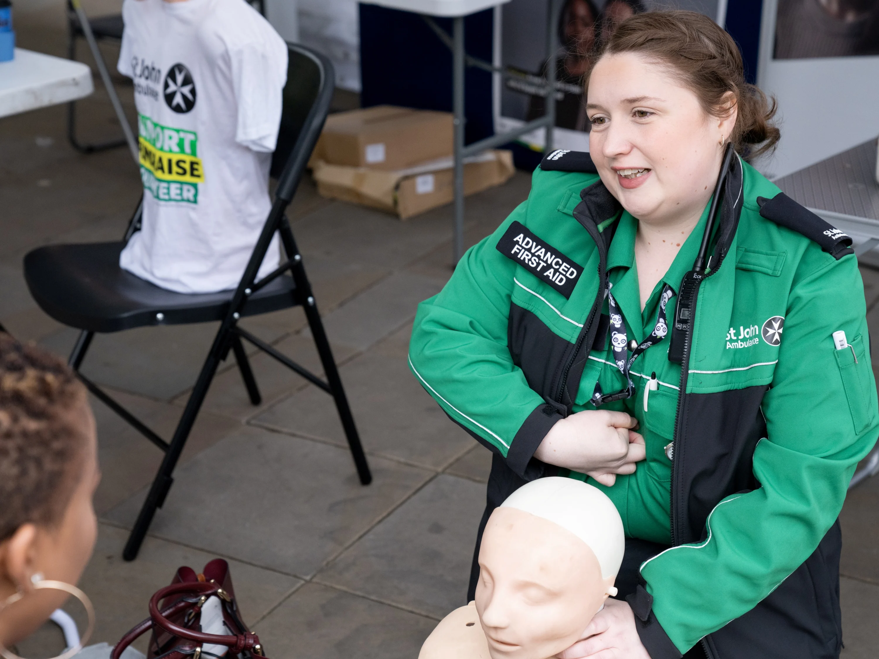 A St John Ambulance trainer giving a demonstration.