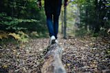 Decorative image of feet walking in forest for article