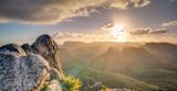 Decorative image of sunrise over mountains for article