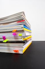Decorative image of stacks of paper for article