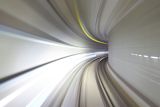 Decorative image of a tunnel being entered at speed for an article