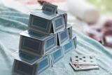 Decorative image of a tower built from playing cards for Introduction to policymaking