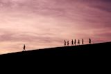 Decorative image of silhouettes walking for article