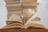 open book in front of stack