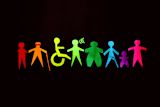 Decorative image of a colourful, paper-cut-out chain of diverse figures, representing different body types, abilities, and identities.
