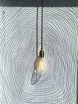 Decorative image of lightbulb on lined background for article