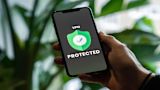 Decorative image of a hand holding a phone that reads 'vpn locked'.