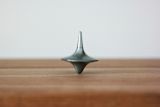 Decorative image of spinning top for article