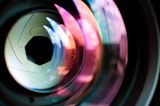 Decorative image of camera lens close up for article