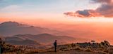 Decorative image of person meditating above clouds for article