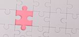 Decorative image of puzzle with missing piece for article