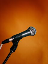 Microphone on orange background