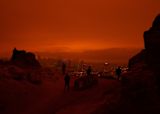 Decorative image of red-cast skyline after fire