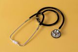 An image of a stethoscope on a yellow background for a Community on the topic of public health