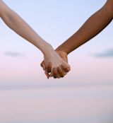 Decorative image of two hands holding for article