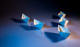 Decorative image of paper boats for article