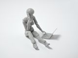 Decorative image of robot model using laptop
