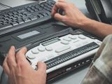 Decorative image of braille writer for article
