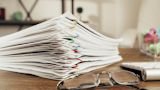 Decorative image of files on desk for article