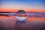 Decorative image of clear ball and sunset for article