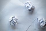 Decorative image of crumpled pieces of paper for article