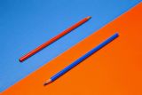 orange pencil blue background blue pencil orange background