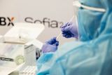 Lab scientist analyses Covid-19 self-test