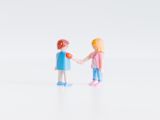 Decorative image of lego handshake for article